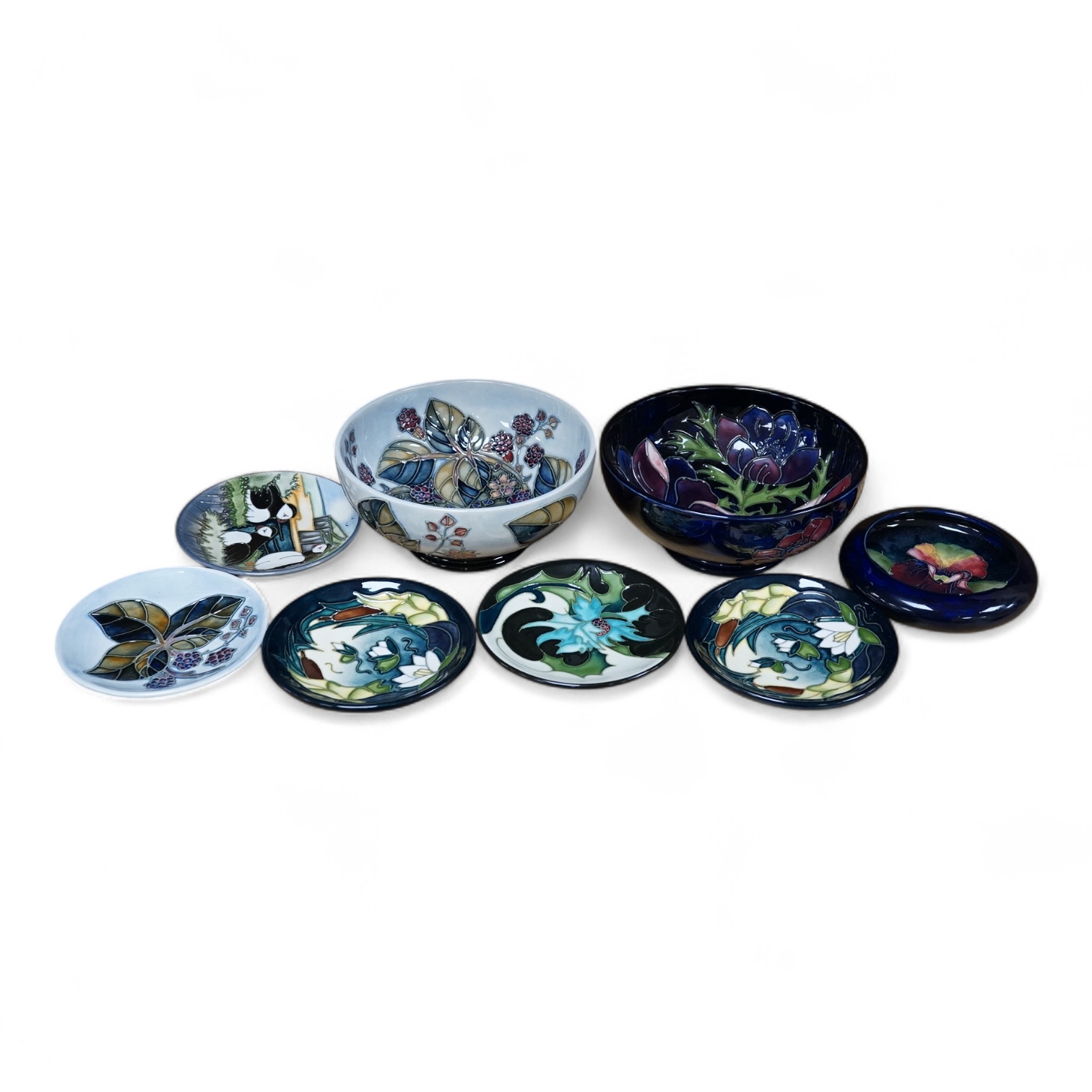 Six small Moorcroft dishes and bowls and two bowls, largest 16cm in diameter